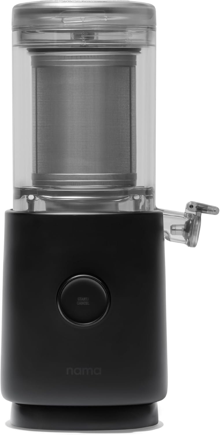 Nama M1 black plant milk maker with a glass pitcher beneath its spout