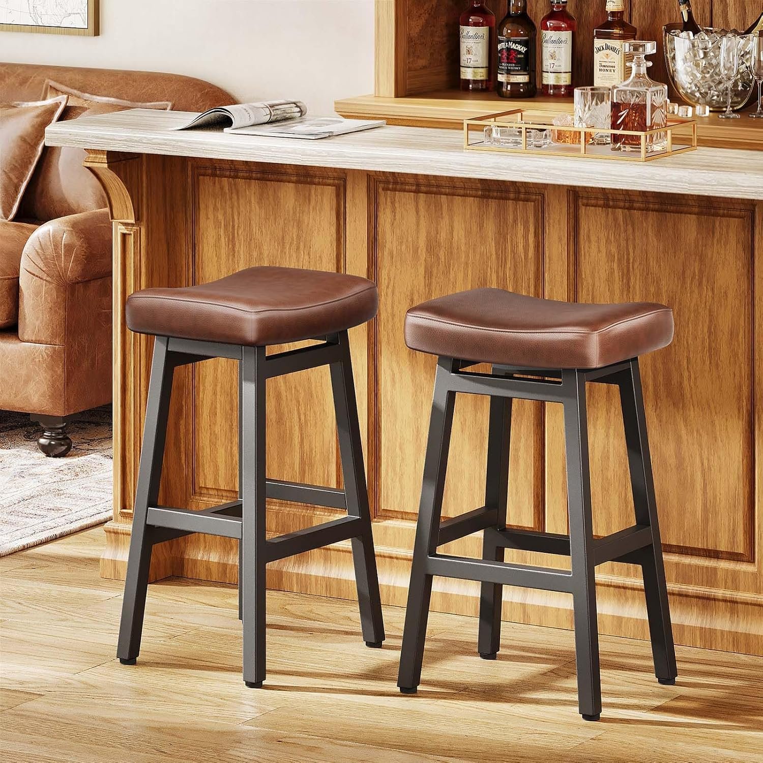 Raynesys backless bonded leather bar stools with curved saddle seats and metal legs